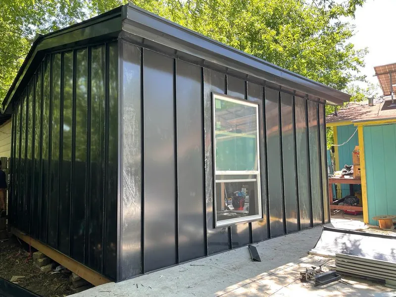 Black standing seam metal wall panels for Metal Roof Installation in Brownsville